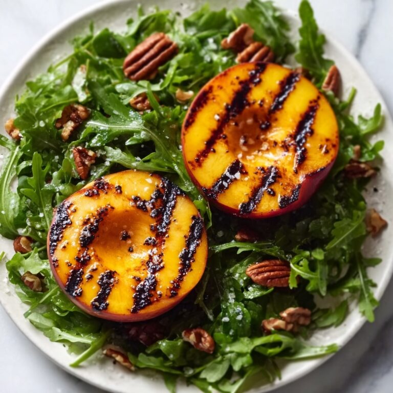 Grilled Peach Salad with Honey Vinaigrette, Candied Curry Pecans, and Blueberries Recipe