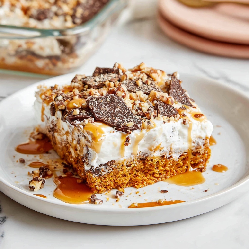 Pumpkin Poke Cake with Caramel, Toffee Bits, and Whipped Cream Recipe - Recipe Image