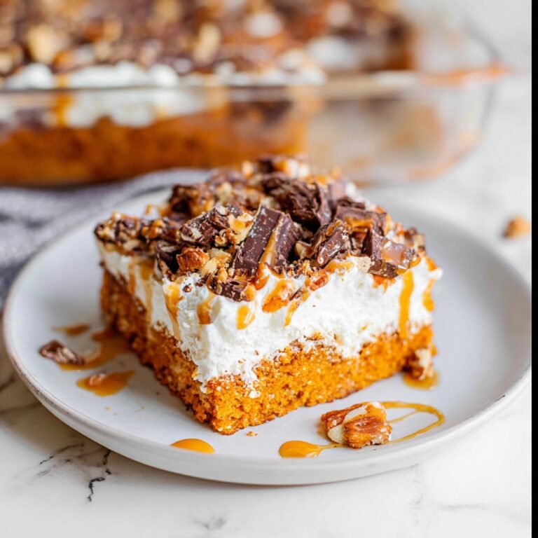 Pumpkin Poke Cake with Caramel, Toffee Bits, and Whipped Cream Recipe